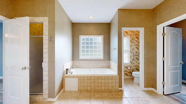 4756 Timarron Loop, Columbus, GA 31909 - bathroom featuring a bath, a shower stall, and tile patterned floors