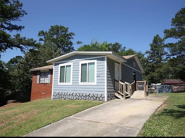 view of home's exterior featuring a lawn