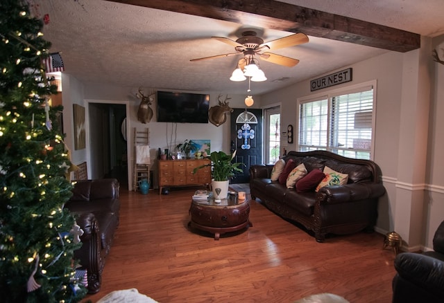 5063 3rd Ave, Columbus, GA 31904 - living area with a ceiling fan, wood finished floors, beam ceiling, and a textured ceiling