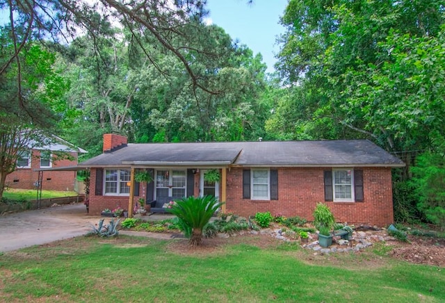 5063 3rd Ave, Columbus, GA 31904 - single story home with brick siding, a front yard, a chimney, and concrete driveway