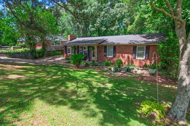 5063 3rd Ave, Columbus, GA 31904 - ranch-style home featuring brick siding, a chimney, and a front lawn