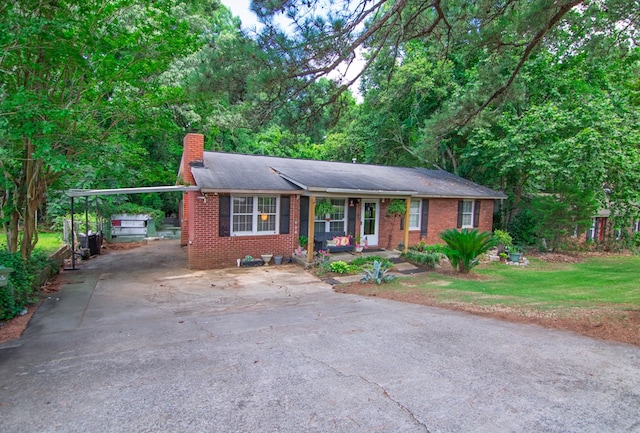 5063 3rd Ave, Columbus, GA 31904 - single story home featuring a chimney, driveway, brick siding, a front yard, and an attached carport