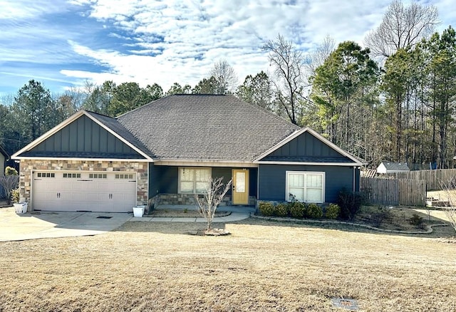 view of front facade featuring a garage and a front lawn