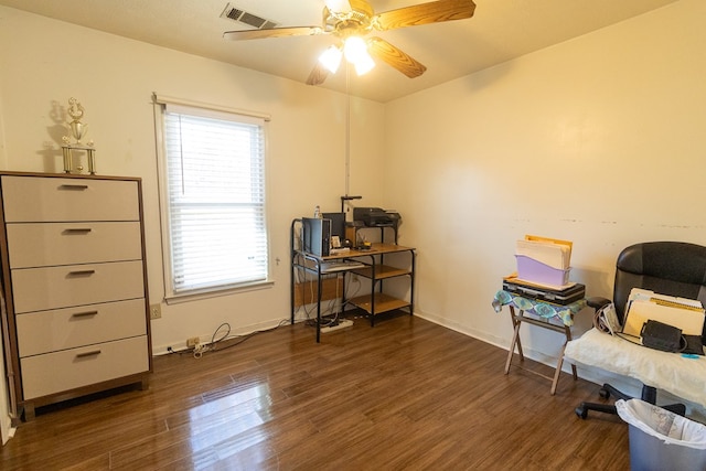 interior space featuring ceiling fan, wood finished floors, visible vents, and baseboards