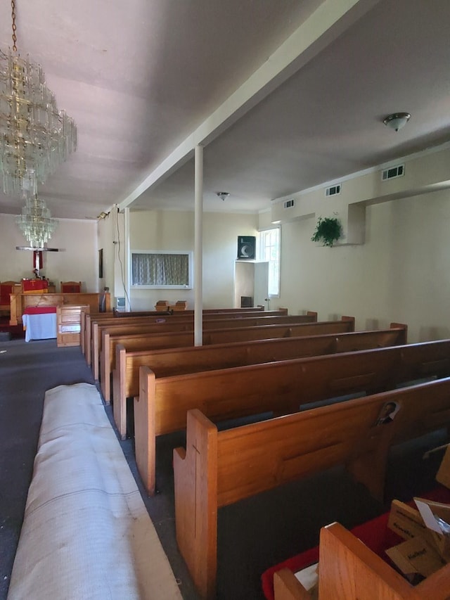 misc room with an inviting chandelier