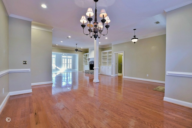 4701 Turnberry Ln Unit 6, Columbus, GA 31909 - unfurnished living room with built in features, ornamental molding, light hardwood / wood-style floors, and ceiling fan with notable chandelier