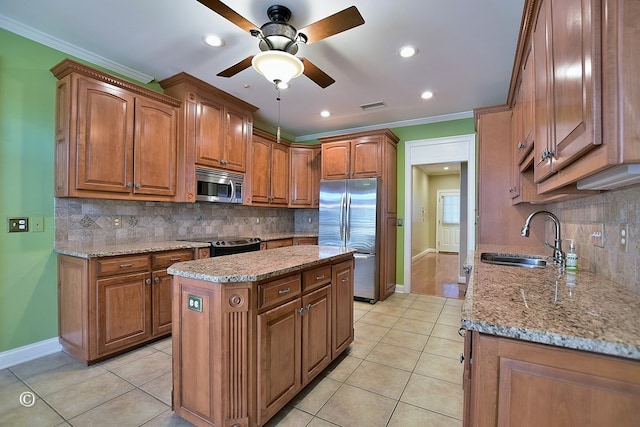 4701 Turnberry Ln Unit 6, Columbus, GA 31909 - kitchen with appliances with stainless steel finishes, sink, light tile patterned flooring, a center island, and crown molding
