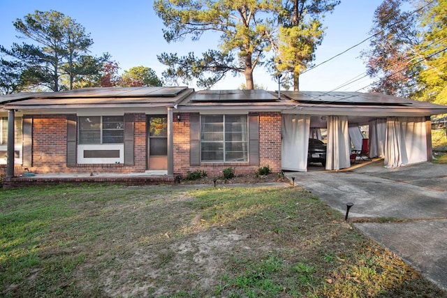 ranch-style house with a front lawn and a carport