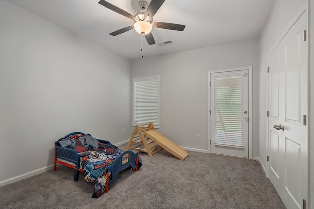 unfurnished bedroom with carpet and ceiling fan