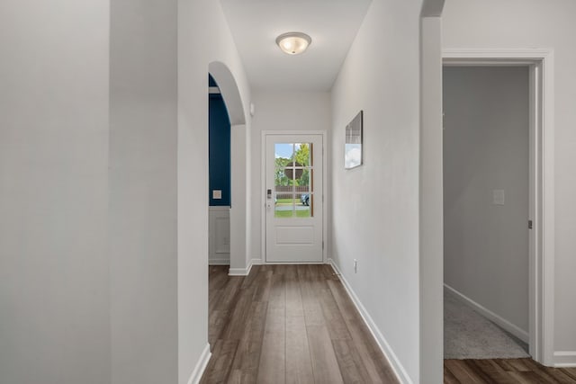 hallway with dark hardwood / wood-style flooring