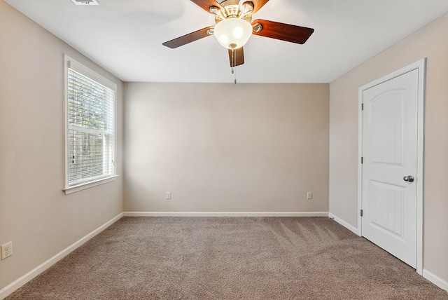 carpeted empty room with ceiling fan