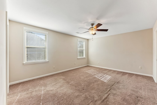 empty room with carpet floors and ceiling fan