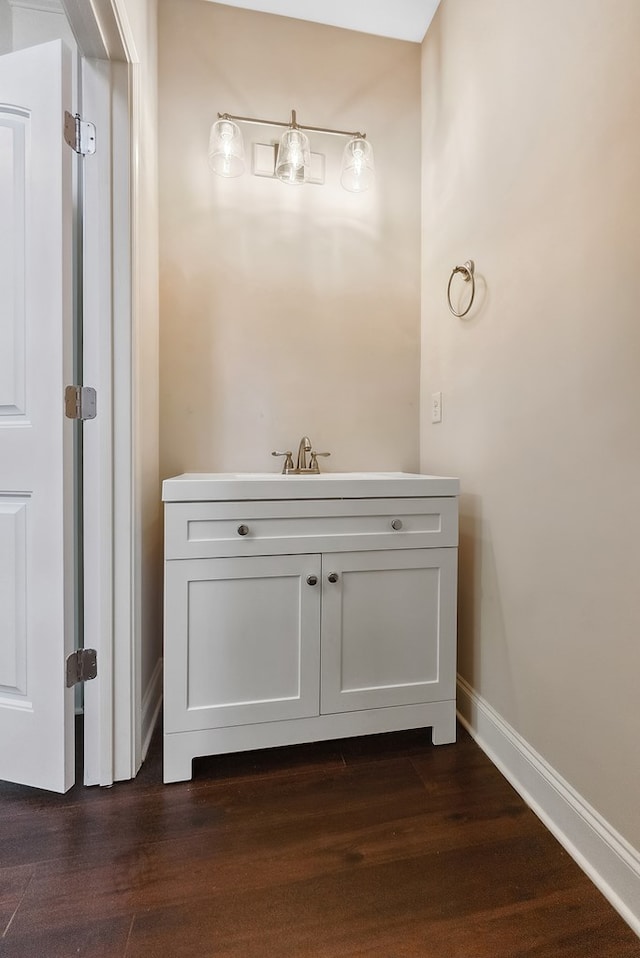 bathroom with vanity and wood-type flooring