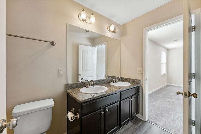 bathroom with vanity and toilet