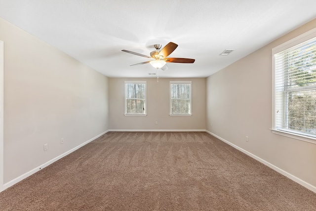 carpeted empty room featuring a textured ceiling and ceiling fan