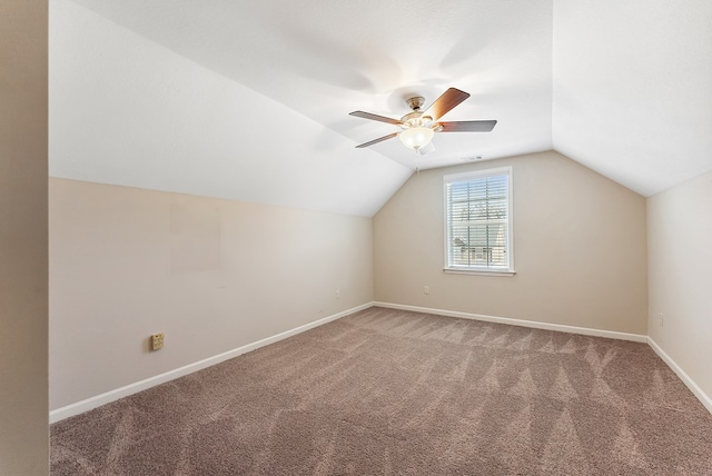 additional living space with lofted ceiling, carpet floors, and ceiling fan