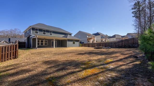 back of house with a yard