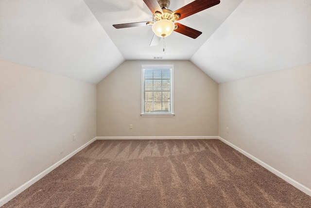 additional living space featuring vaulted ceiling, carpet floors, and ceiling fan