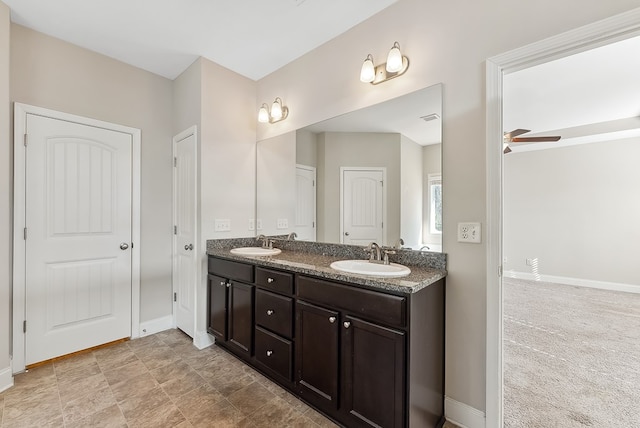 bathroom featuring vanity and ceiling fan