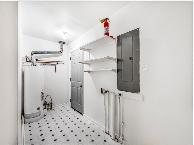 clothes washing area featuring electric panel, light floors, water heater, and baseboards