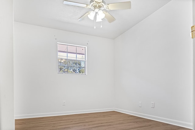 unfurnished room featuring wood finished floors, a ceiling fan, and baseboards