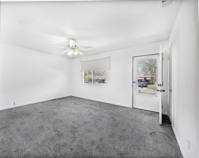 unfurnished room with carpet flooring, ceiling fan, visible vents, and baseboards