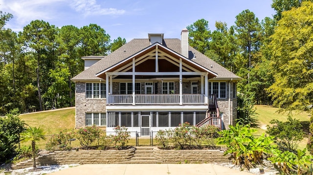 back of property featuring a lawn