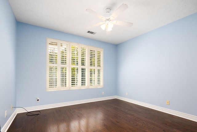 spare room featuring ceiling fan, wood-type flooring, and a textured ceiling