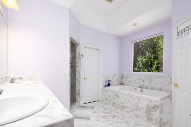 bathroom with vanity and independent shower and bath