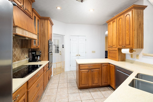 kitchen with backsplash, premium range hood, light tile patterned floors, kitchen peninsula, and stainless steel appliances