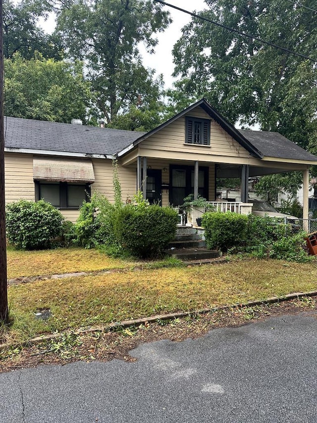 view of front of property with a front lawn and a porch