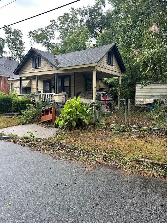 bungalow with a porch and a carport