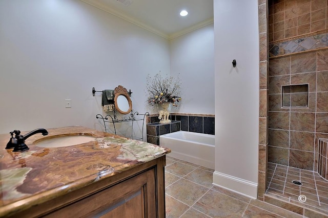 bathroom featuring plus walk in shower, vanity, and ornamental molding