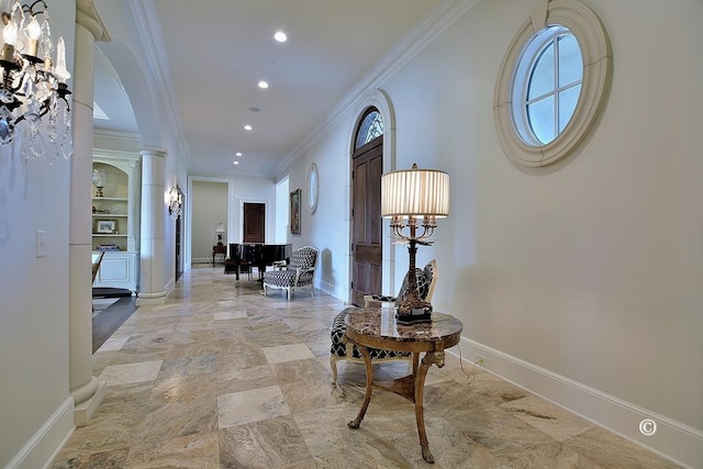 corridor featuring ornate columns and ornamental molding