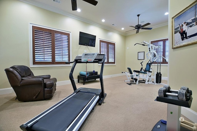 exercise room featuring ceiling fan, crown molding, and light carpet