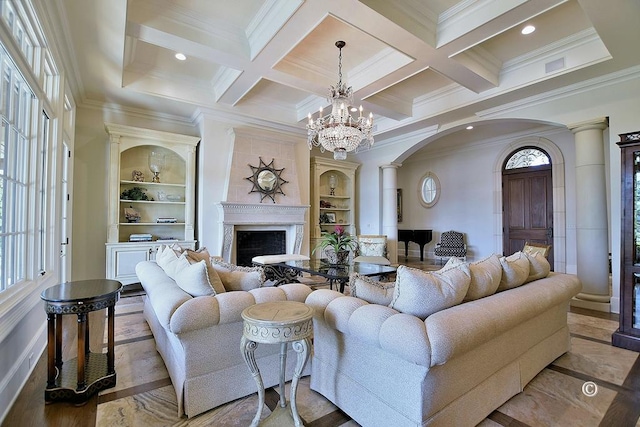 living room featuring coffered ceiling, crown molding, a wealth of natural light, and decorative columns