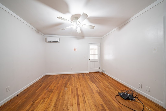 1518 Preston Dr, Columbus, GA 31906 - empty room with an AC wall unit, crown molding, light wood-type flooring, ceiling fan, and baseboards