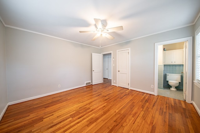 1518 Preston Dr, Columbus, GA 31906 - unfurnished bedroom with light wood-style flooring, baseboards, ornamental molding, ensuite bathroom, and ceiling fan