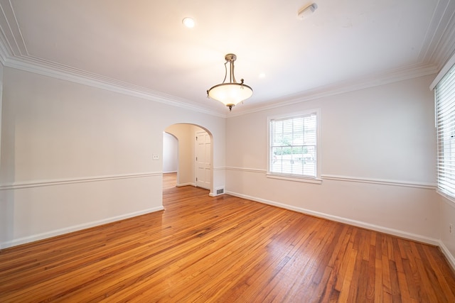 1518 Preston Dr, Columbus, GA 31906 - empty room featuring arched walkways, light wood-style floors, baseboards, and crown molding