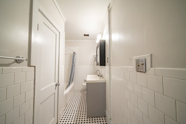 1518 Preston Dr, Columbus, GA 31906 - bathroom with tile walls, vanity, a wainscoted wall, shower / bath combo with shower curtain, and ornamental molding