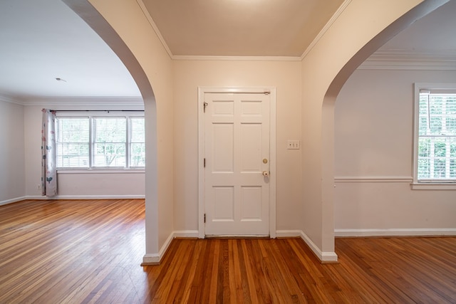 1518 Preston Dr, Columbus, GA 31906 - foyer featuring arched walkways, wood finished floors, ornamental molding, and baseboards