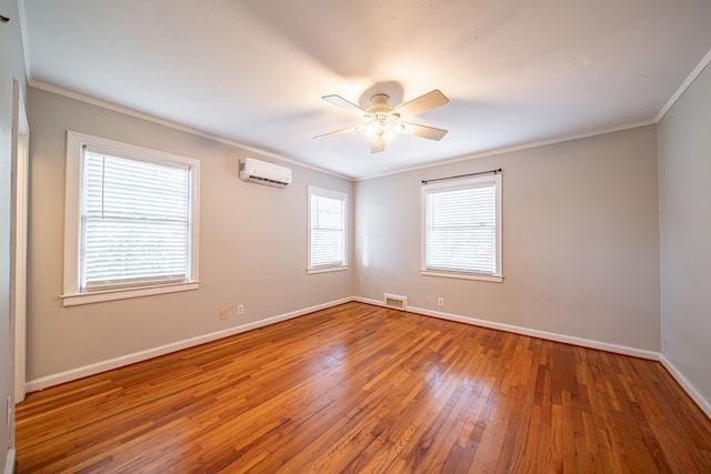 1518 Preston Dr, Columbus, GA 31906 - unfurnished room with a wall mounted air conditioner, ornamental molding, hardwood / wood-style floors, baseboards, and ceiling fan