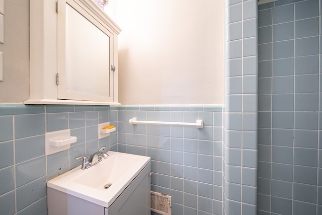 1518 Preston Dr, Columbus, GA 31906 - bathroom with vanity, tile walls, and a wainscoted wall
