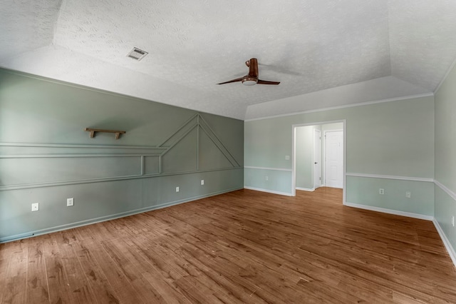 1506 Lokey Dr, Columbus, GA 31904 - additional living space with wood finished floors, ceiling fan, a textured ceiling, baseboards, and a decorative wall