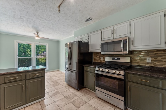 1506 Lokey Dr, Columbus, GA 31904 - kitchen featuring appliances with stainless steel finishes, tasteful backsplash, ceiling fan, light tile patterned flooring, and a textured ceiling