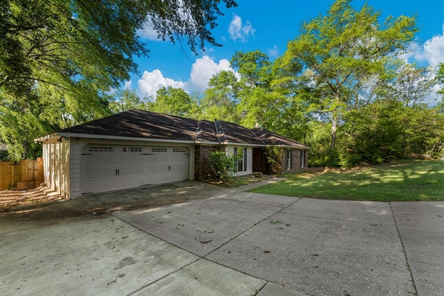 1506 Lokey Dr, Columbus, GA 31904 - single story home featuring concrete driveway, a garage, and a front yard