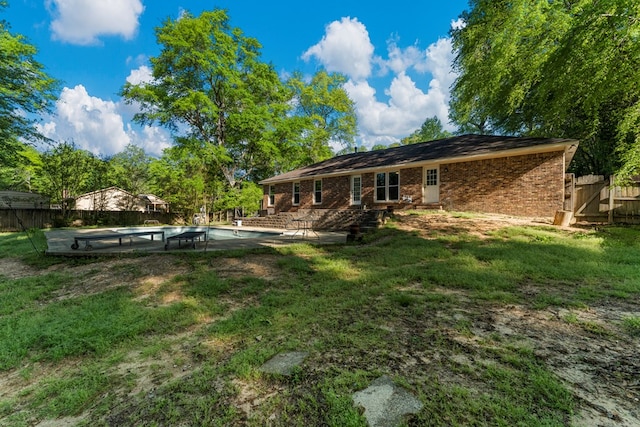 1506 Lokey Dr, Columbus, GA 31904 - rear view of house featuring brick siding and a patio