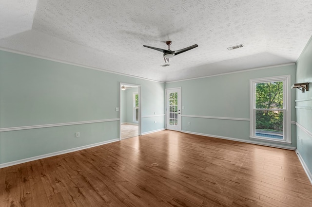 1506 Lokey Dr, Columbus, GA 31904 - unfurnished room with a ceiling fan, wood finished floors, plenty of natural light, a textured ceiling, and ornamental molding