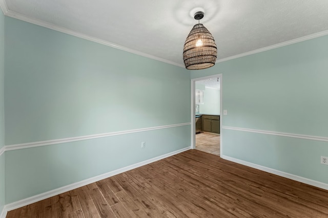 1506 Lokey Dr, Columbus, GA 31904 - empty room featuring wood finished floors, baseboards, and crown molding