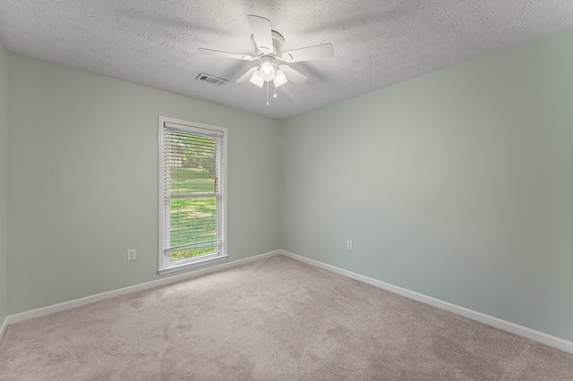 1506 Lokey Dr, Columbus, GA 31904 - spare room featuring carpet, a ceiling fan, baseboards, and a textured ceiling